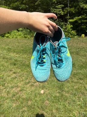 Nike Women's Teal Athletic Shoes with Neon Yellow Swoosh